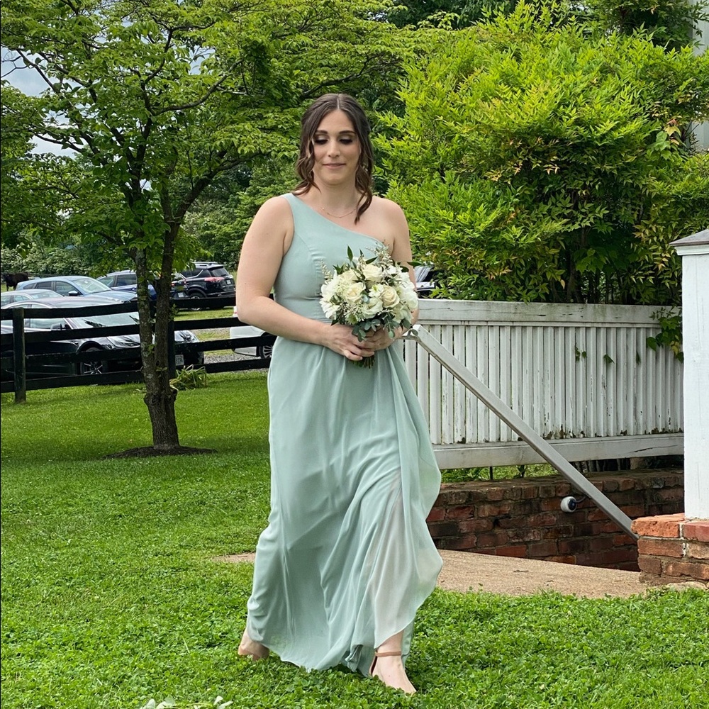 David’s Bridal Bridesmaid one shoulder dress in sage green.